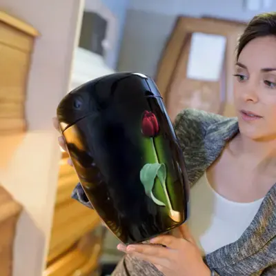 A woman looking at a personalized urn